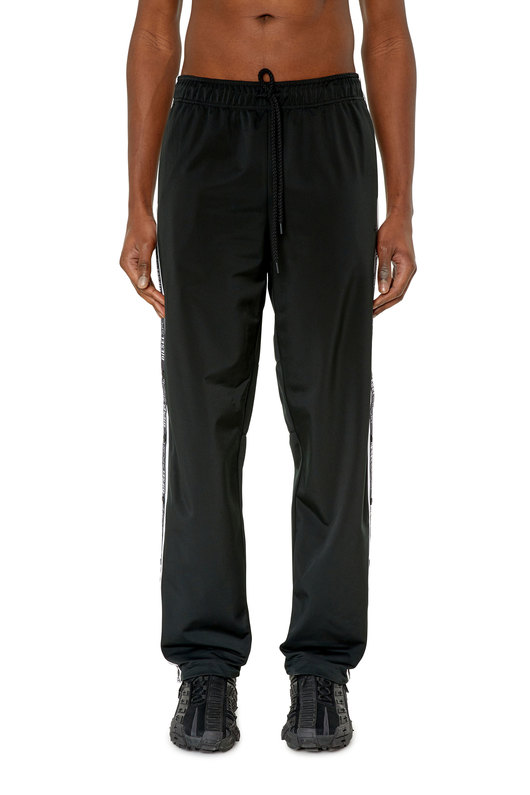 Track pants with logo tape openings